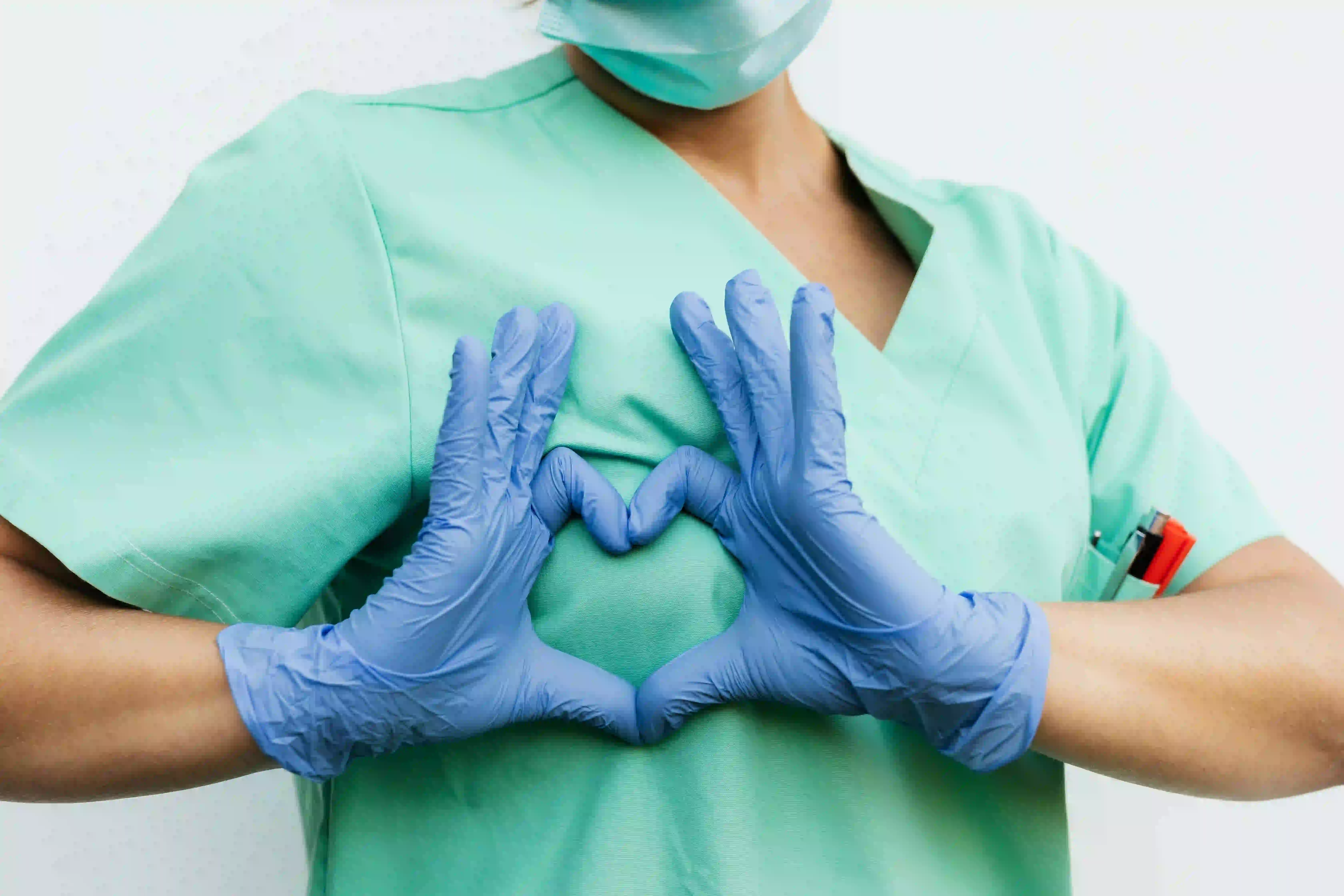 Nurse showing heart